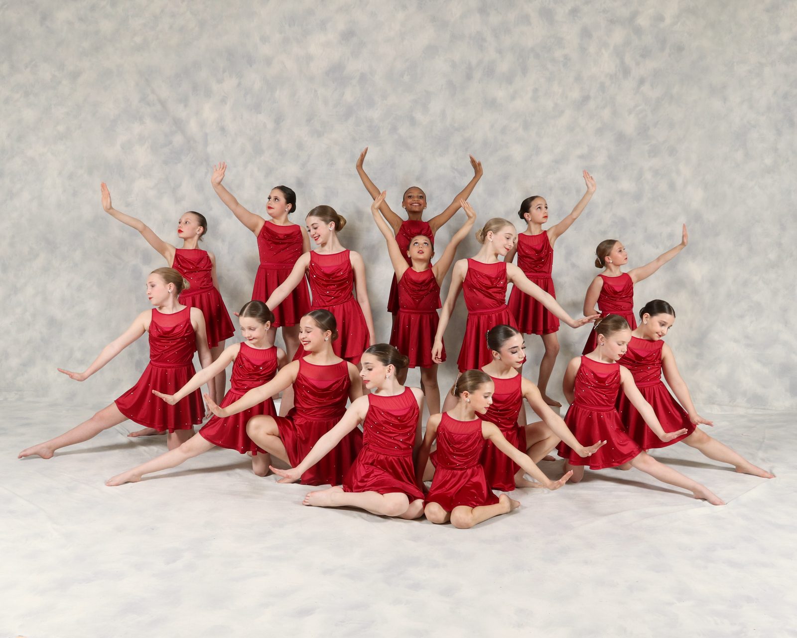 AYDC lyrical group in red velvet dresses