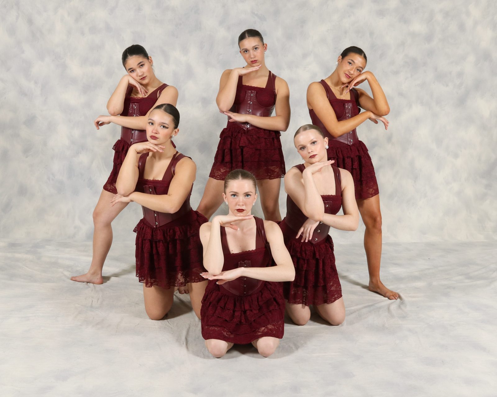 AYDC dancers in burgundy velvet costumes